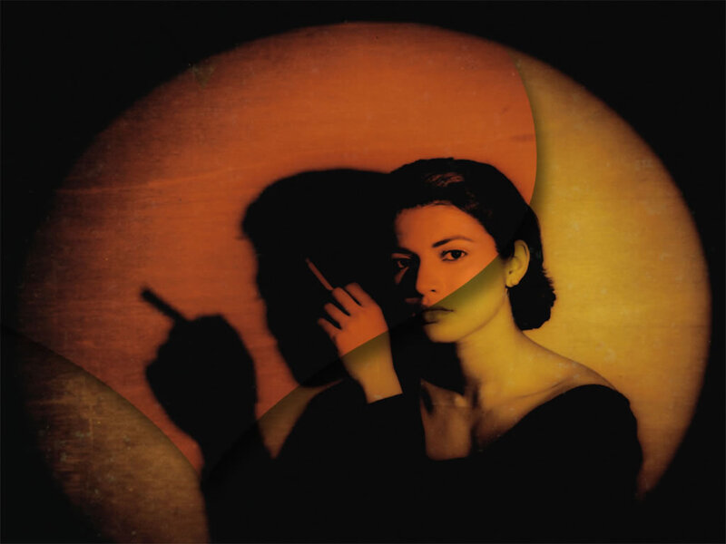 woman with cigarette in spotlight