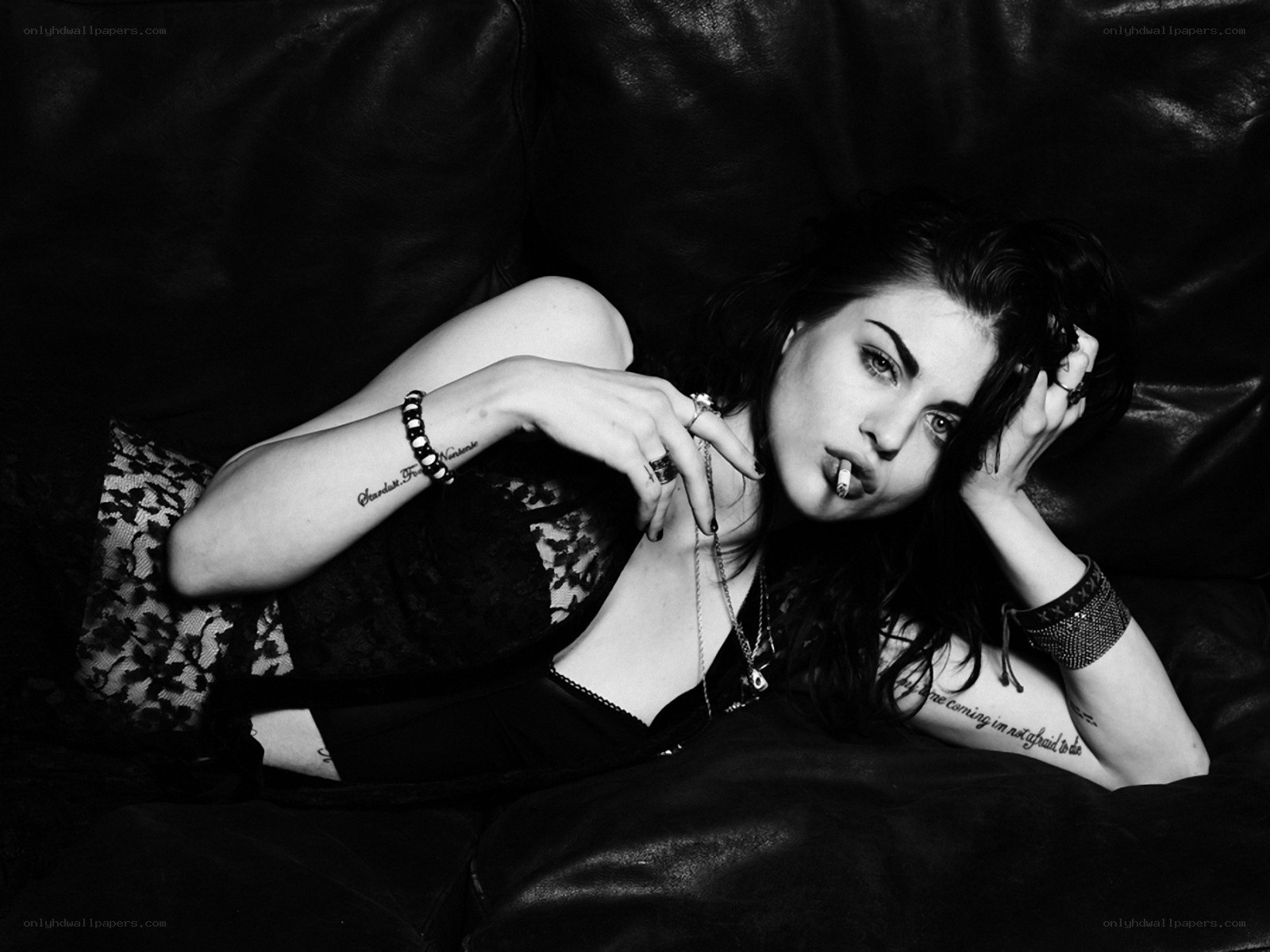 woman with cigarette on couch