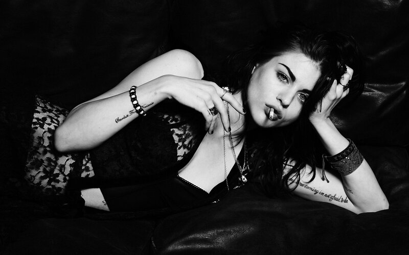 woman with cigarette on couch