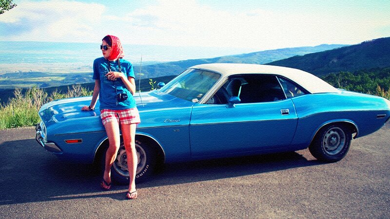 Woman with classic blue car
