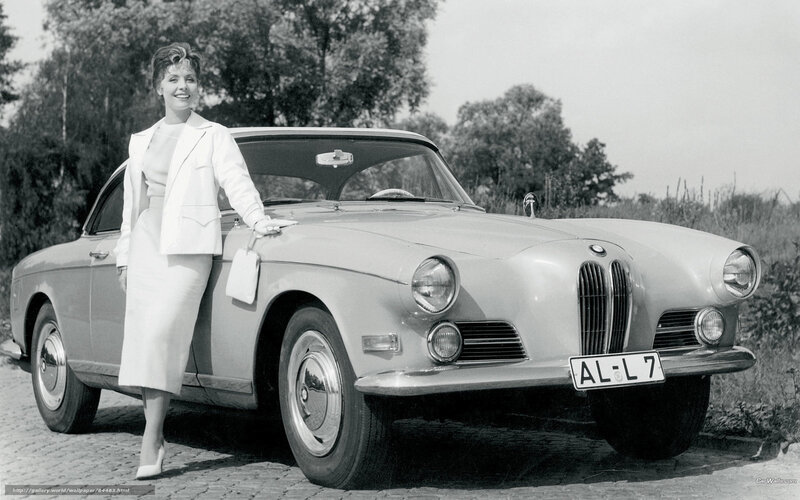 Woman with classic BMW car