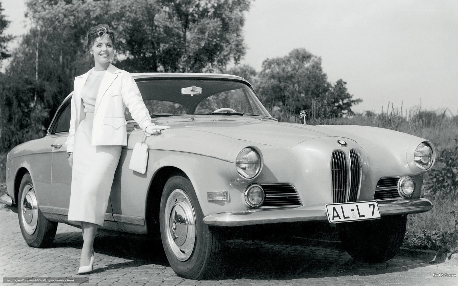 Woman with classic BMW car