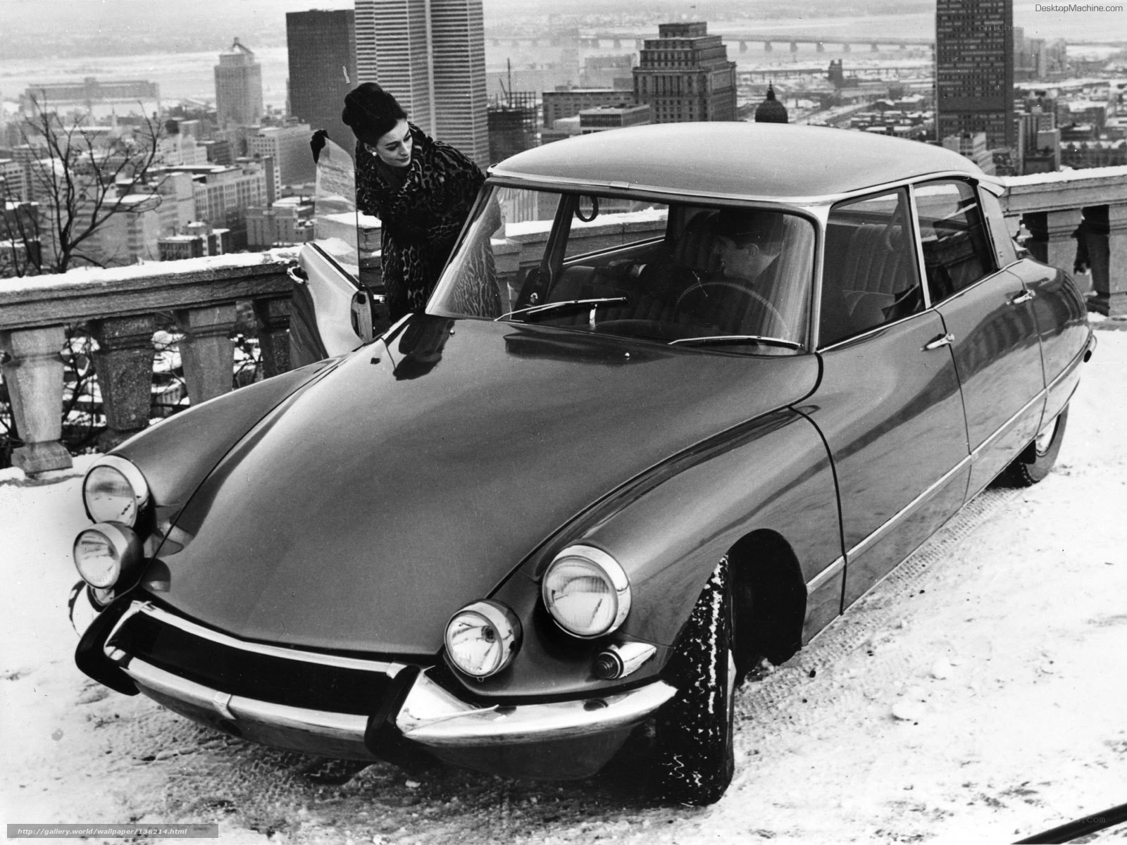 Woman with classic car in city