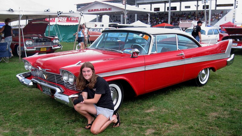 Woman with classic red car