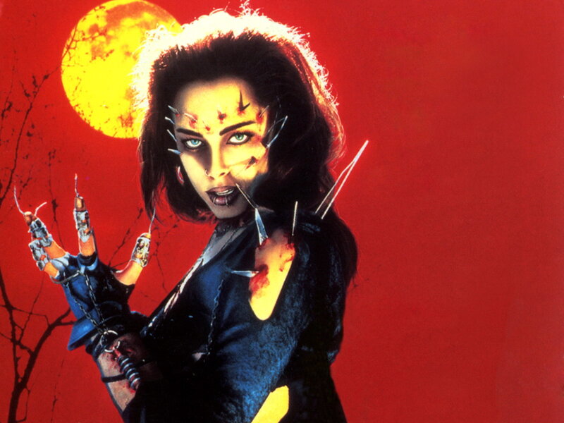 Woman with Claws and Face Piercings