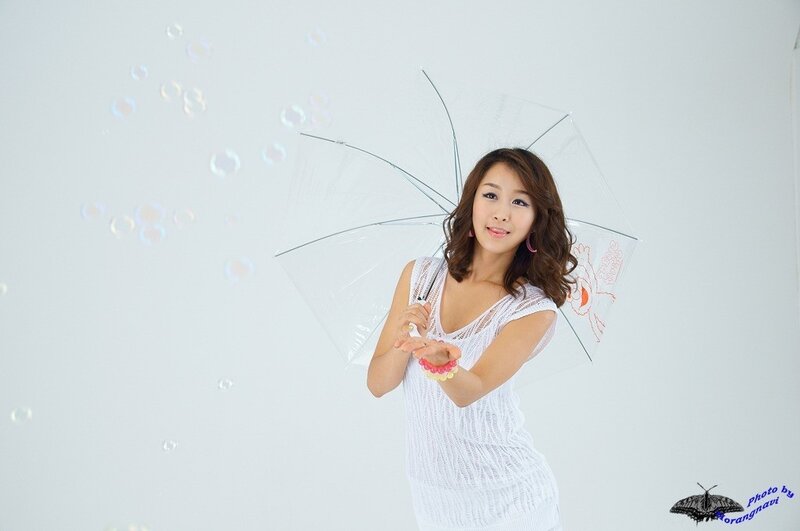 woman with clear umbrella and bubbles