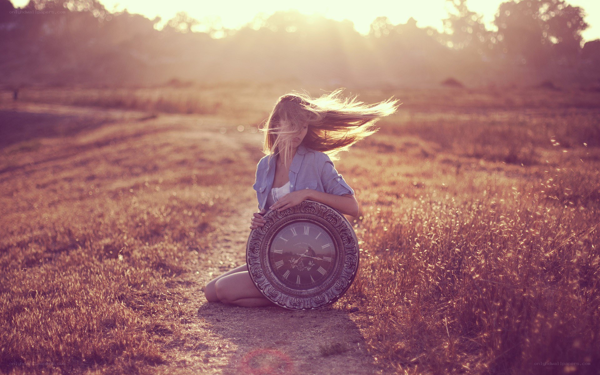 woman with clock in field