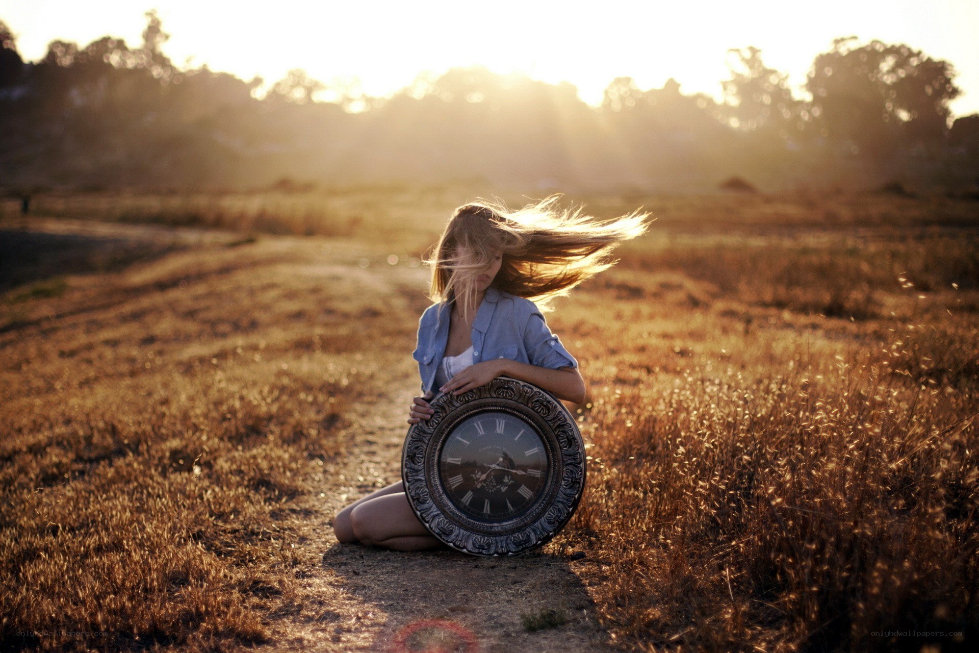 Woman with clock in field
