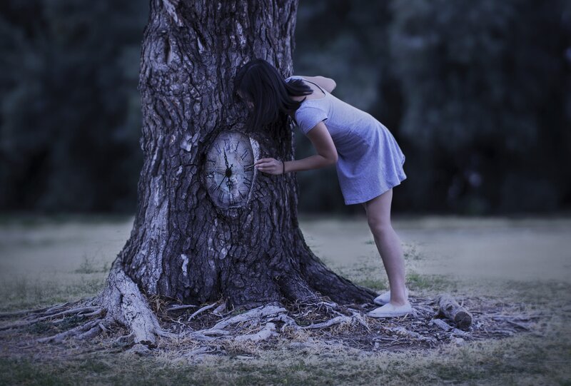 Woman with Clock in Tree
