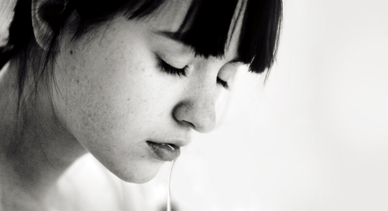 woman with closed eyes in profile