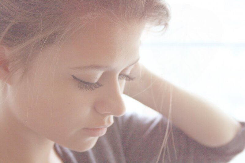 woman with closed eyes in soft light