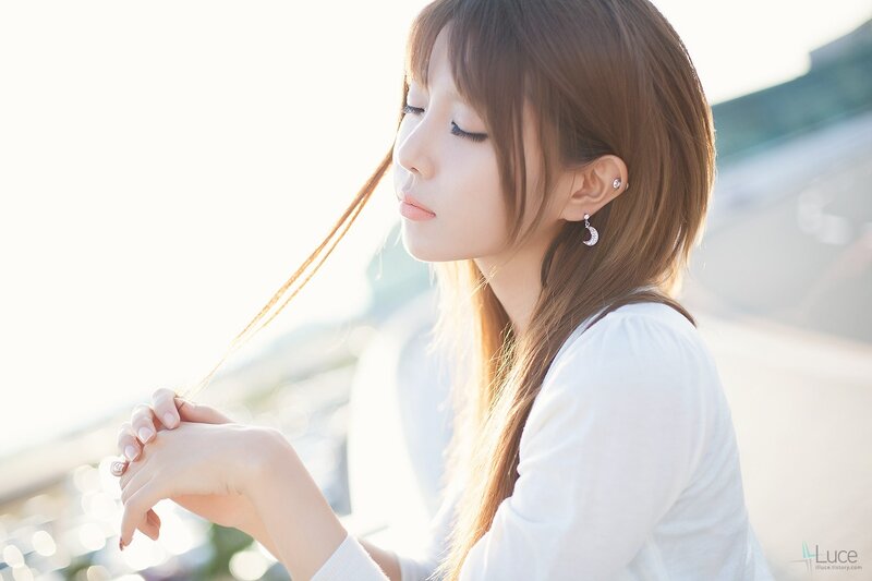 woman with closed eyes in sunlight