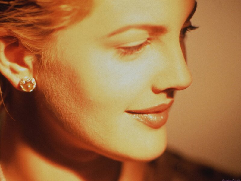 woman with closed eyes in warm light