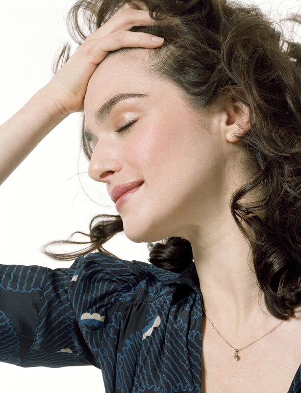 woman with closed eyes smiling