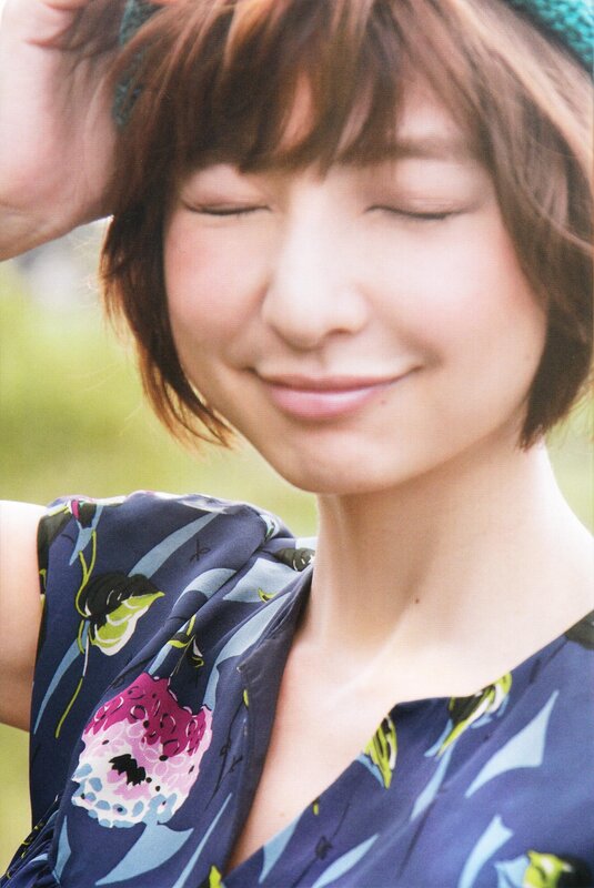 woman with closed eyes smiling
