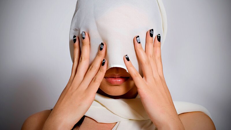 woman with cloth over face