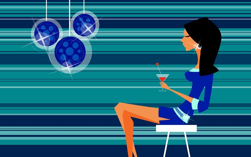woman with cocktail at bar