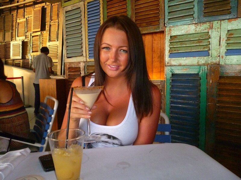 woman with cocktail at restaurant