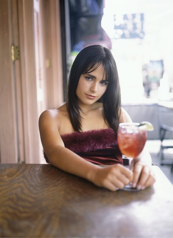 woman with cocktail at table