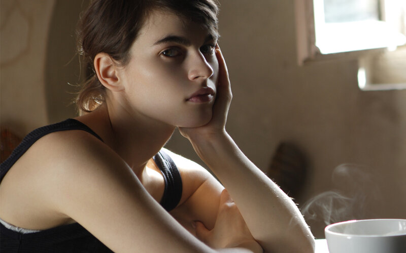 woman with coffee in contemplation