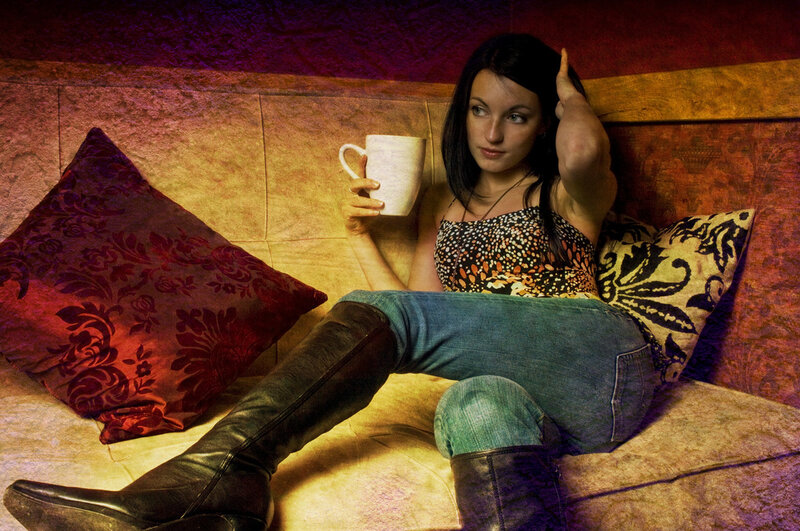 Woman with coffee mug on couch