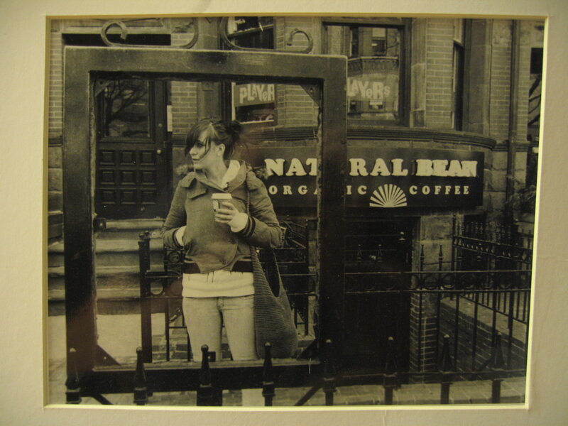 Woman with coffee outside cafe