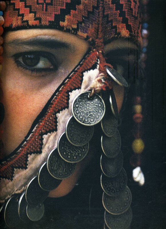 woman with coin-adorned headwear
