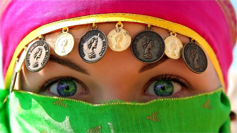 woman with coins on forehead