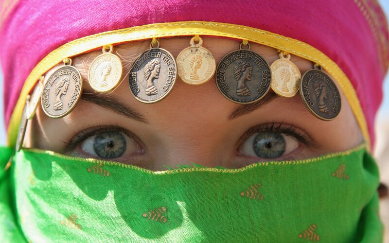 woman with coins on headband