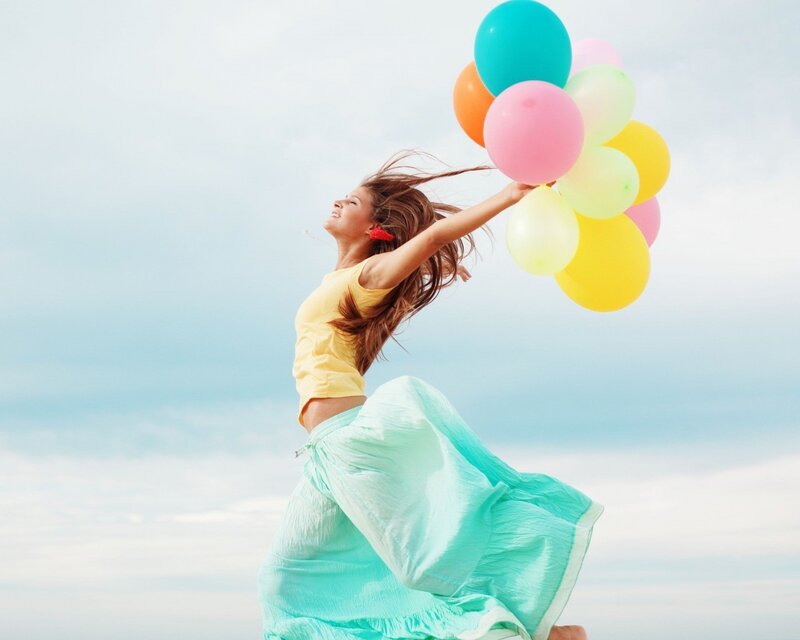 woman with colorful balloons
