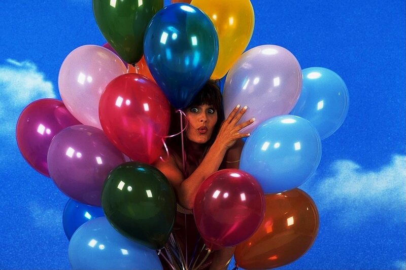 woman with colorful balloons