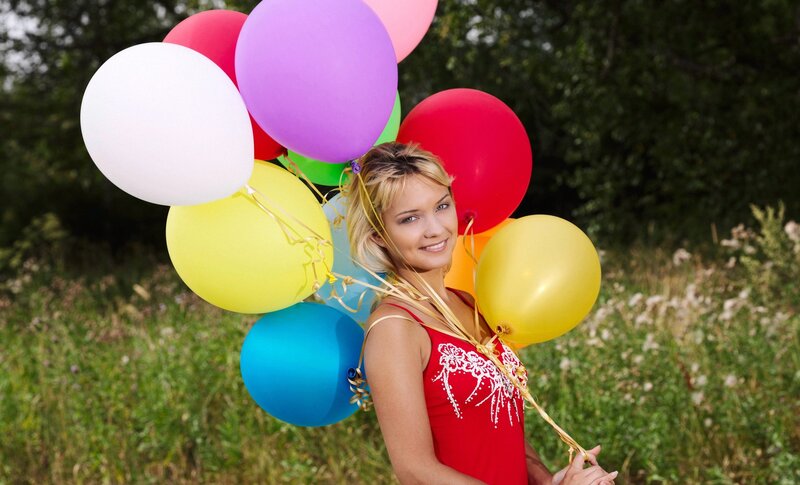Woman with colorful balloons