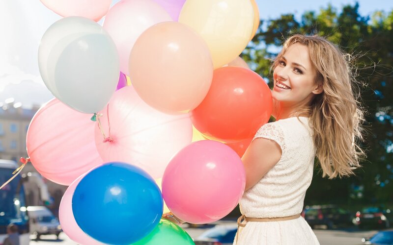 Woman with colorful balloons