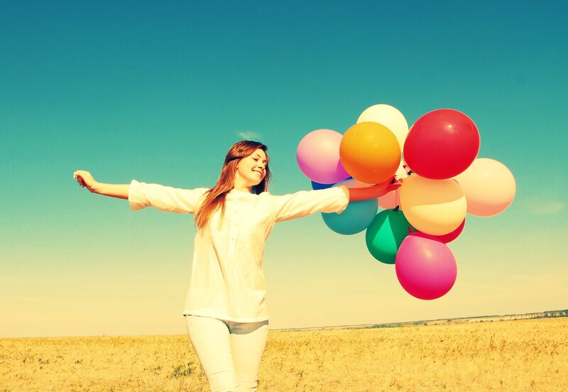 Woman with colorful balloons
