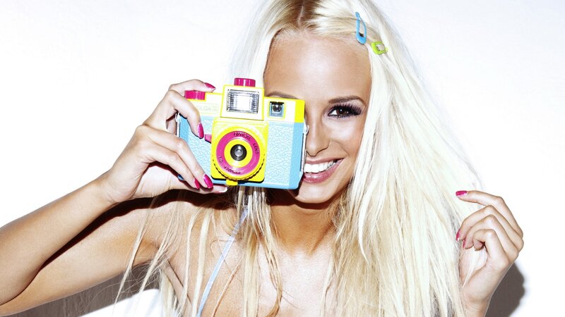 Woman with colorful camera