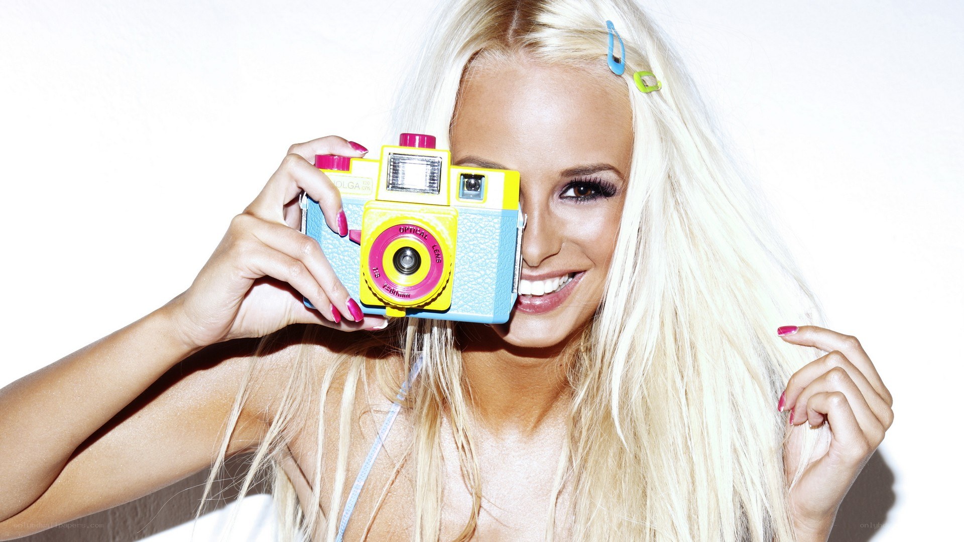 Woman with colorful camera