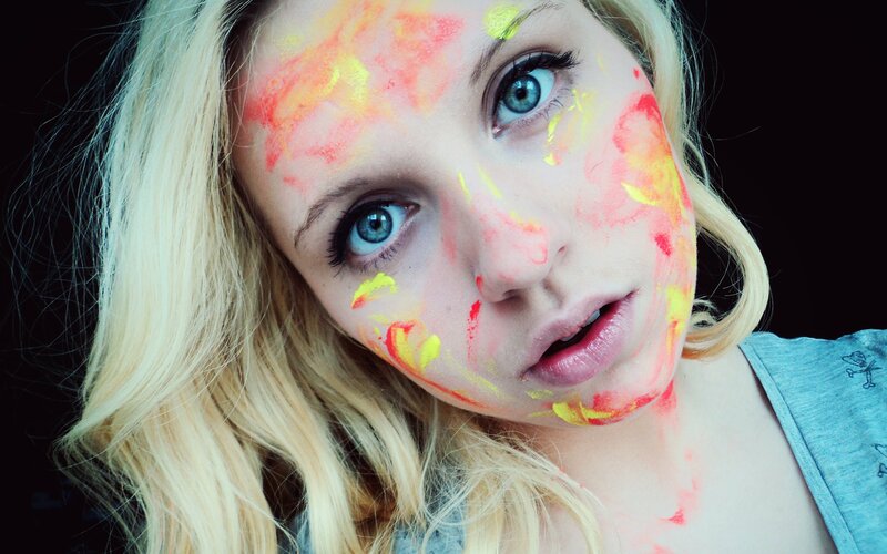 woman with colorful face paint