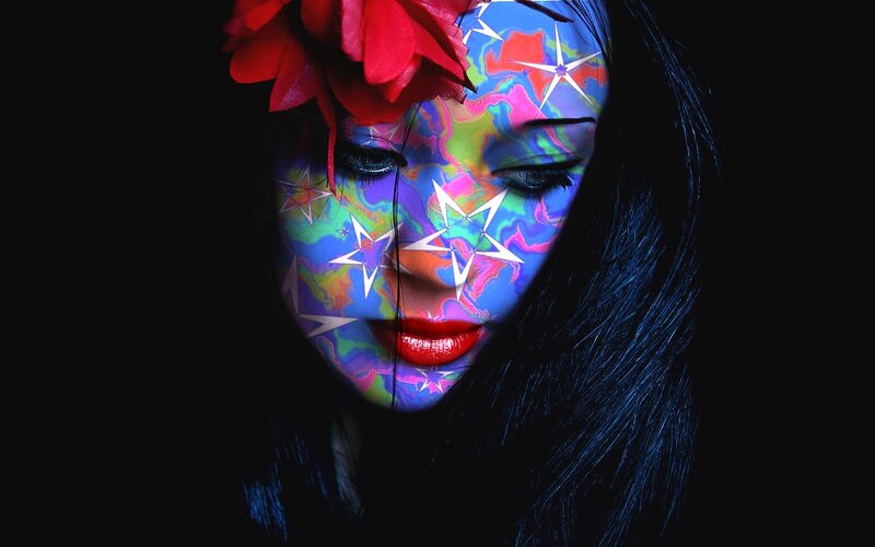 Woman with Colorful Face Paint — Blue, Dramatic