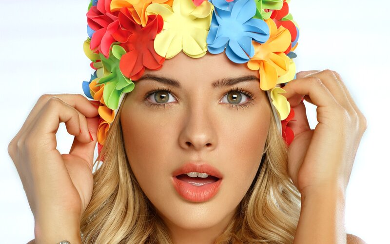woman with colorful flower hat