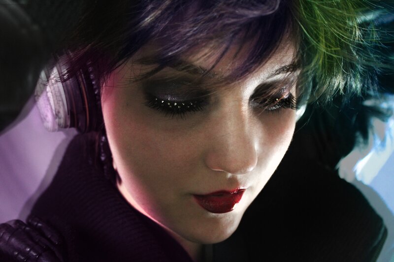 woman with colorful hair and headphones