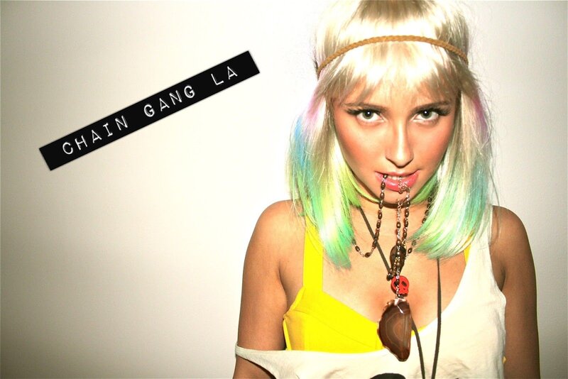 woman with colorful hair and necklace