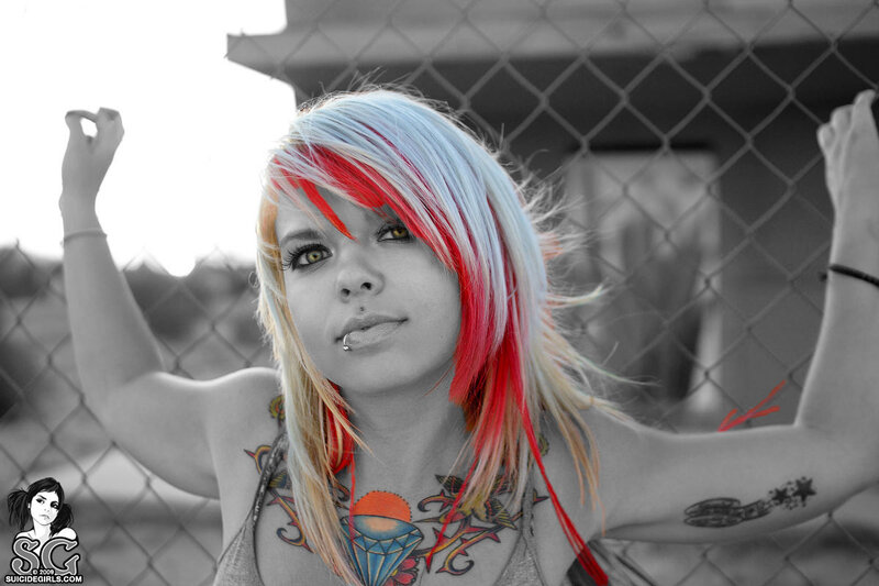 woman with colorful hair and tattoos