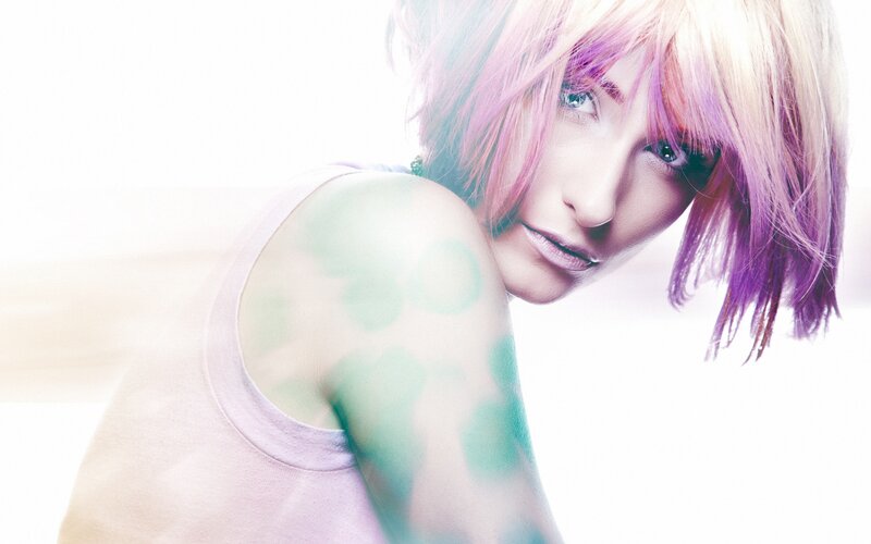 woman with colorful hair and tattoos