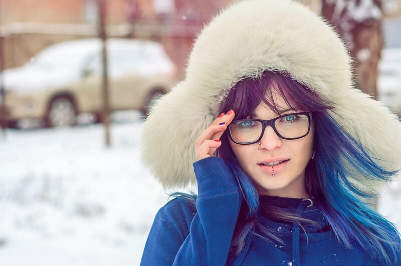 woman with colorful hair in winter