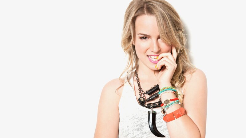 woman with colorful jewelry smiling