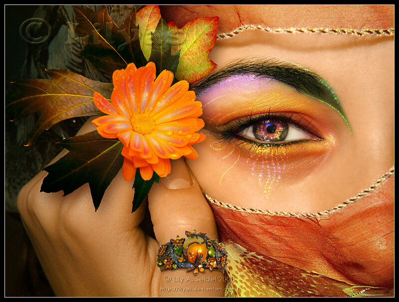 woman with colorful makeup and flower