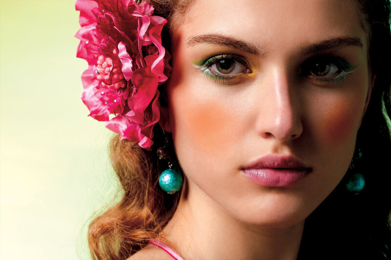woman with colorful makeup and flower