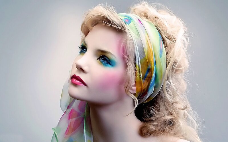 woman with colorful makeup and scarf