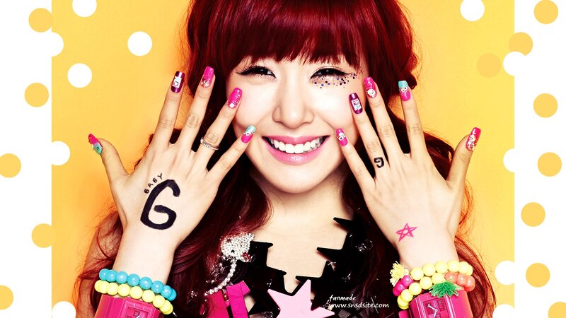 woman with colorful nails and red hair