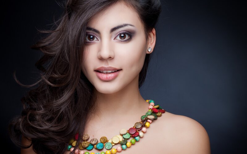 Woman with Colorful Necklace — Brown